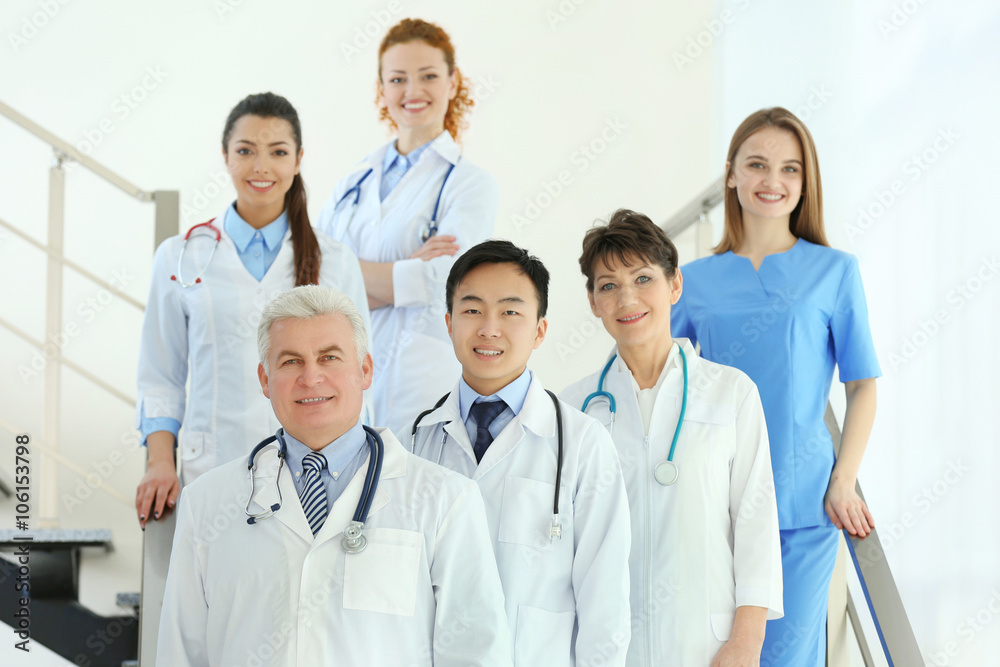 Team of smiling doctors indoors