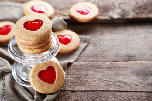 Love cookies with grey cloth on wooden background  closeup