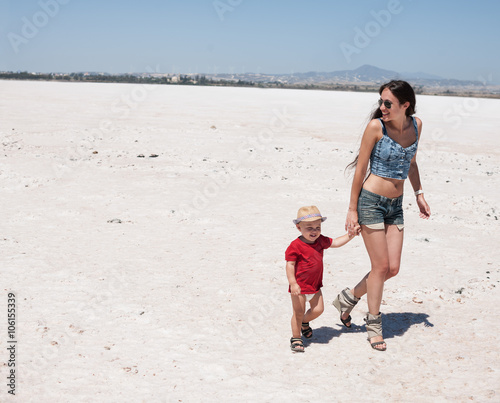 Mother and baby on the beach