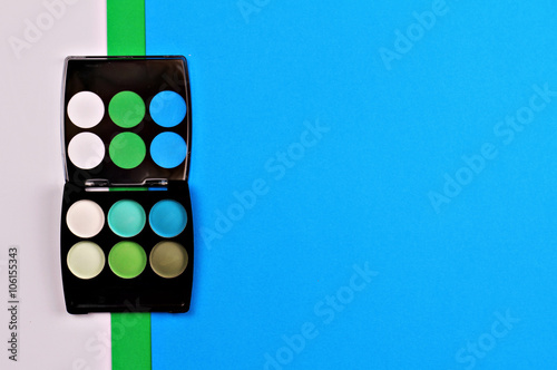 Eye shadows on colorful geometric background. Simple, Mimalism wallpaper. Make up concept photo