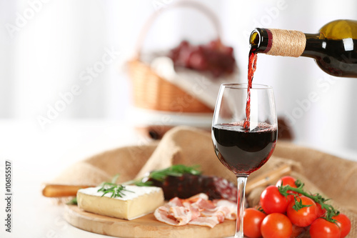 Glass of wine with food on table closeup