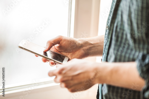 men holding mobile phone close-up shot