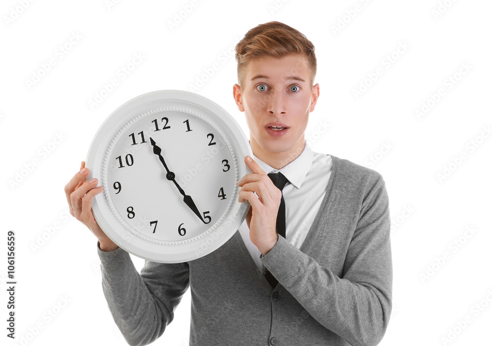 Handsome young man holding clock, isolated on white Handsome young man holding clock, isolated on white