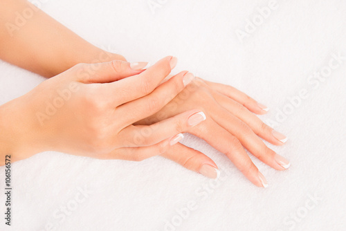 Close up photo of woman s hand with manicure on white background