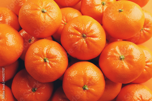 Fresh tangerines background with the multiple water drops, top view