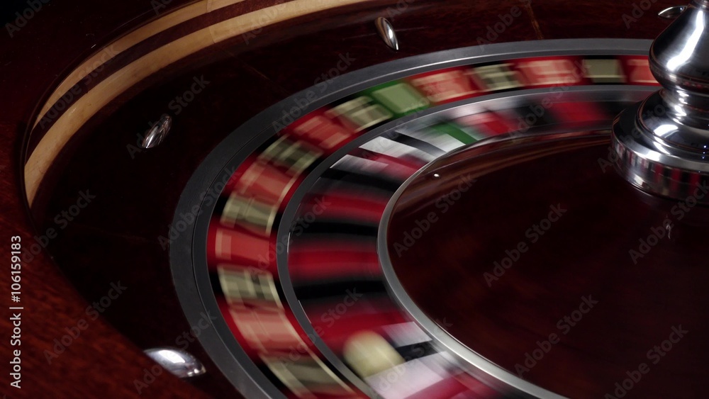 One part of fast running wheel roulette, white ball falls on 22, close up
