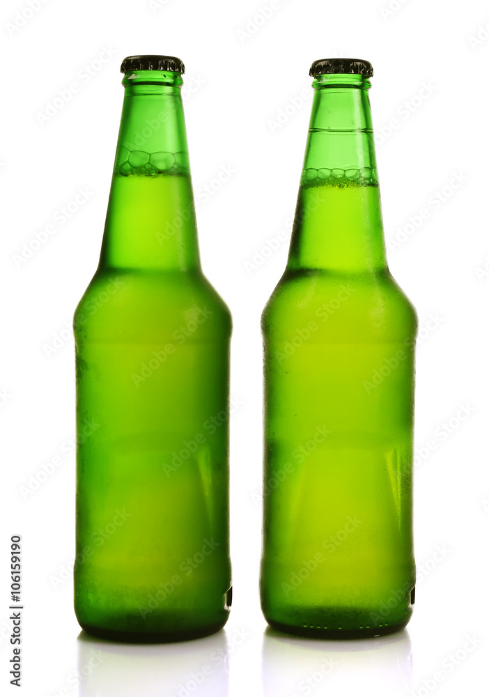 Two green glass bottles with beer, isolated on white Two green glass bottles with beer, isolated on white