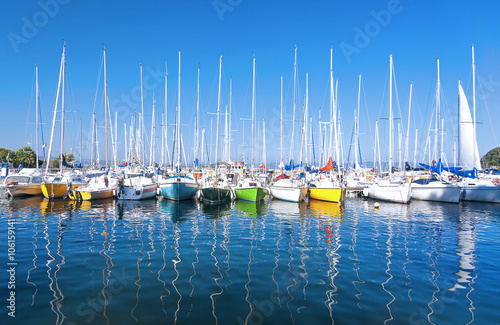 Sailing boats, of various colors, moored