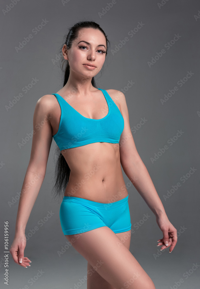 Muscular young woman athlete standing Muscular young woman athlete standing