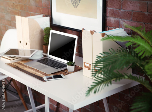 Workplace with table and di...