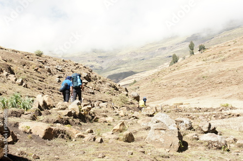 Trekkers in Simien mountains under Bwahit pass, Ethiopia 