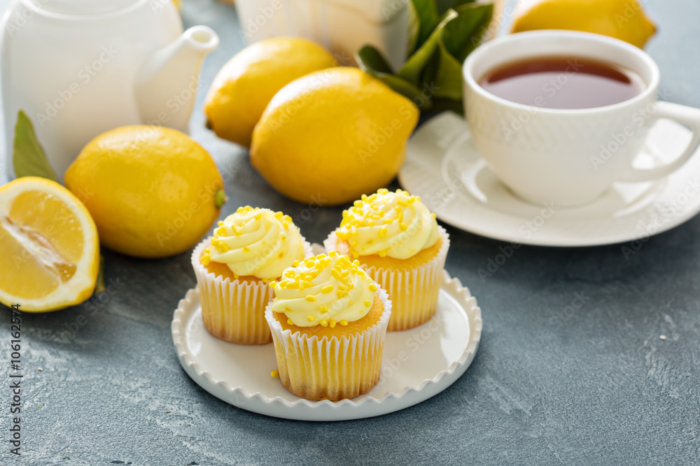 Lemon cupcakes with bright yellow frosting Lemon cupcakes with bright yellow frosting