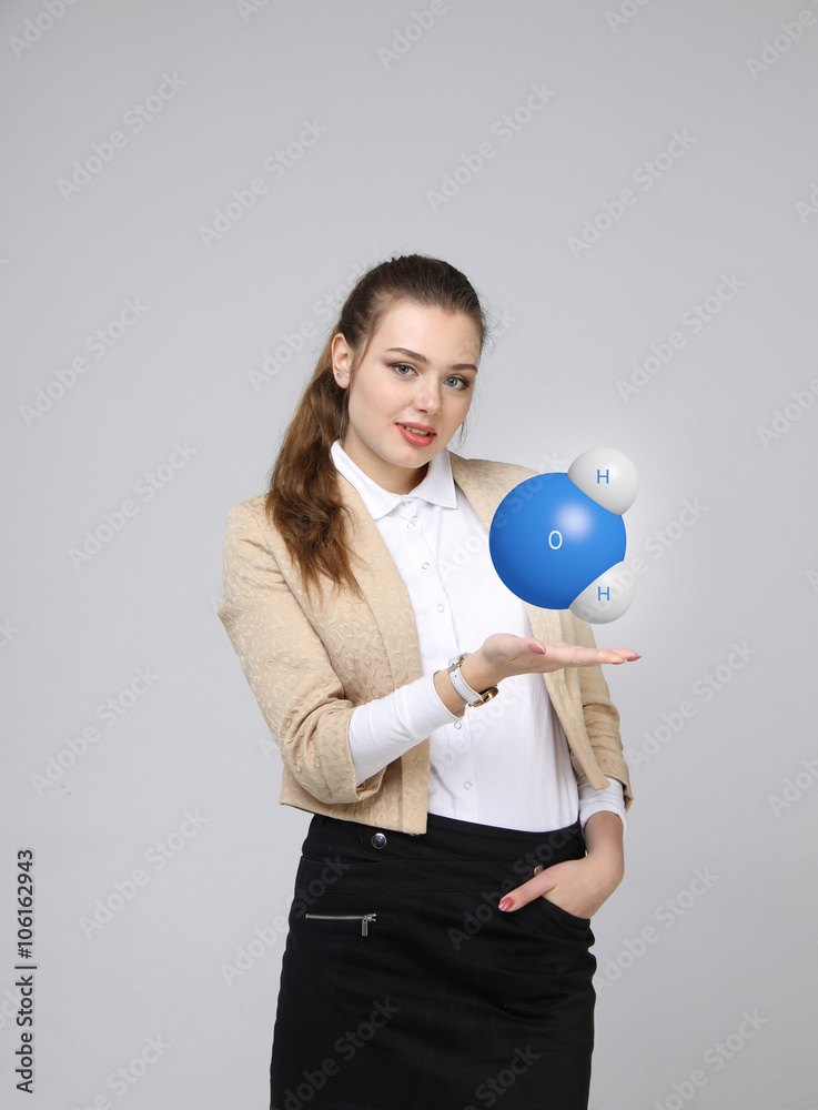 Young woman scientist with model of water molecule. Young woman scientist with model of water molecule.