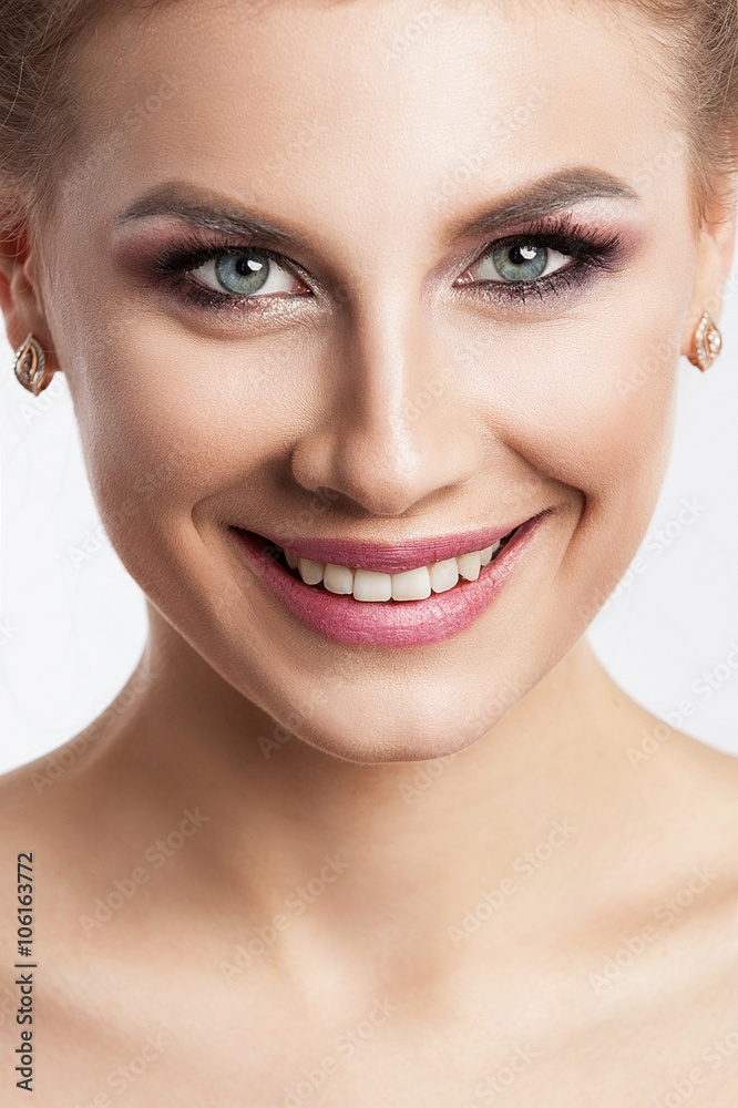 Beauty model girl with perfect make-up isolated over white. Portrait of attractive young woman with blond hair on white background. Beautiful female face with clear fresh skin Beauty model girl with perfect make-up isolated over white. Portrait of attractive young woman with blond hair on white background. Beautiful female face with clear fresh skin