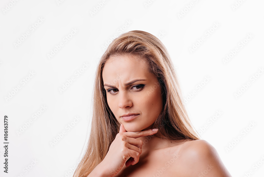 Naklejka premium beautiful girl thinking on a white background