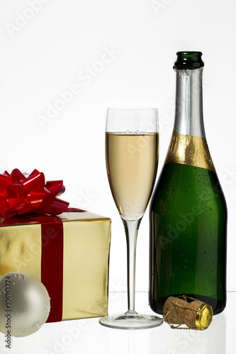 champagne flute and bottle with christmas gift