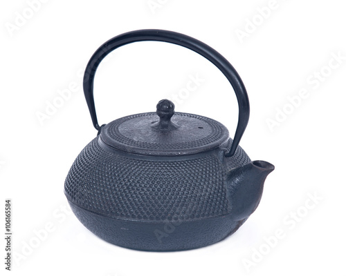 Old cast iron tea pot separated on white background
