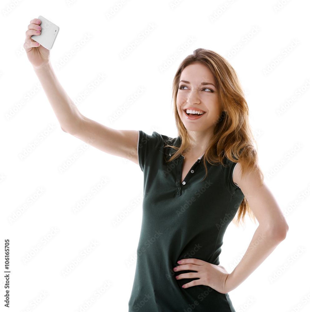 Young attractive woman taking selfie with mobile phone isolated on white Young attractive woman taking selfie with mobile phone isolated on white