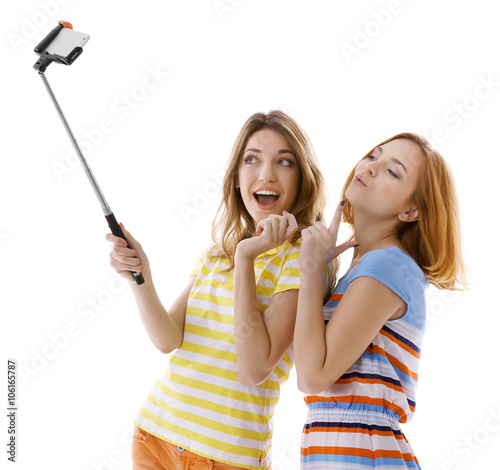 Two young women taking self...