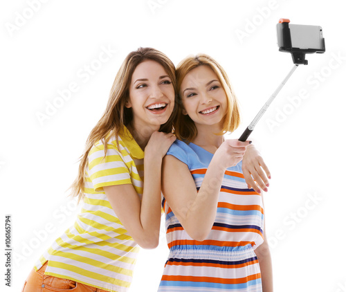 Two young women taking self...