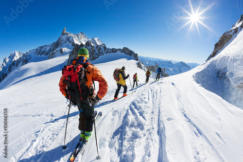 A group of skiers start the descent of Vallée Blanche, Mont Blanc Massif, Chamonix, France.