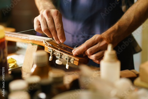 Artisan Lute Maker Fixing Stringed Instrument Replacing Guitar C photo
