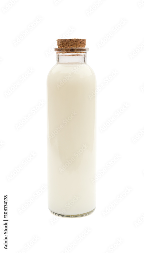 bottle of milk with wood plug on white with clipping path