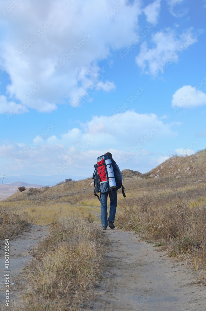 A tourist walks along the trail