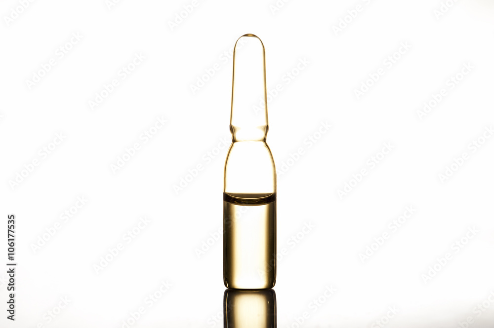 Beauty ampule, medical ampule with vaccine. Vial with liquid. Macro. Beauty ampule, medical ampule with vaccine. Vial with liquid. Macro.