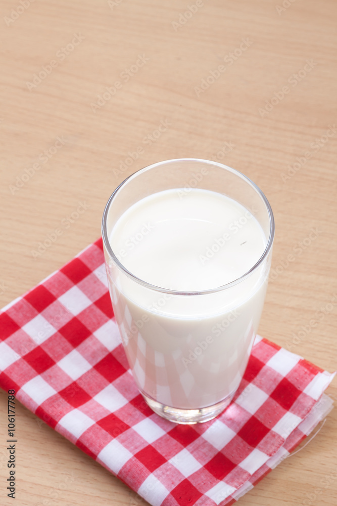 Glass of Milk on Wood with Tablecloth Glass of Milk on Wood with Tablecloth