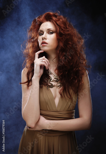 woman with bright red curly hair