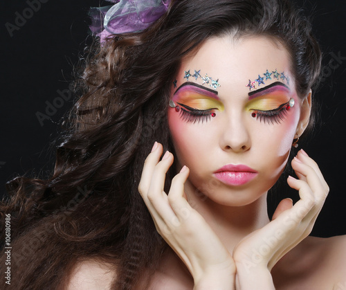 Beautiful lady with artistic make-up.
