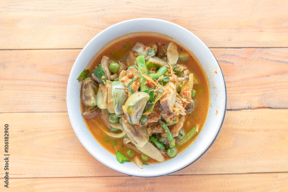 Close up spicy red curry with chicken and herbs Close up spicy red curry with chicken and herbs