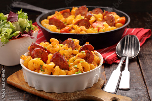 Tableau sur toile Casserole with chorizo sausage on wooden background
