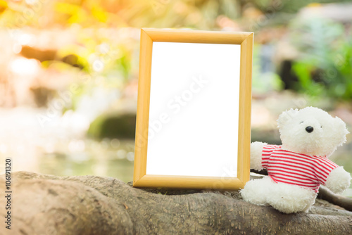 Teddy bears and picture frames with river in background ,have sp photo