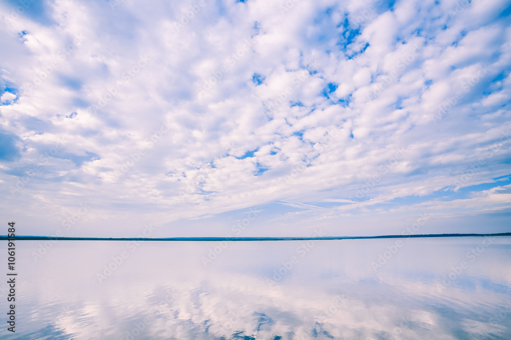 White Cloudscape Over Water Surface Of Lake Pond River White Cloudscape Over Water Surface Of Lake Pond River