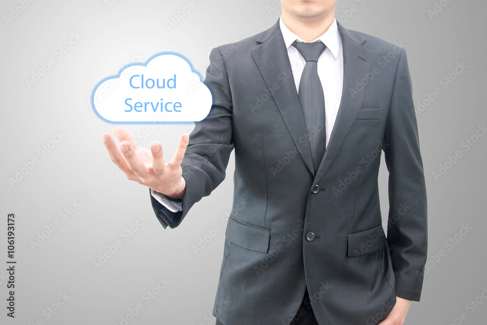 Cloud computing concept on hand of a businessman in suit Cloud computing concept on hand of a businessman in suit
