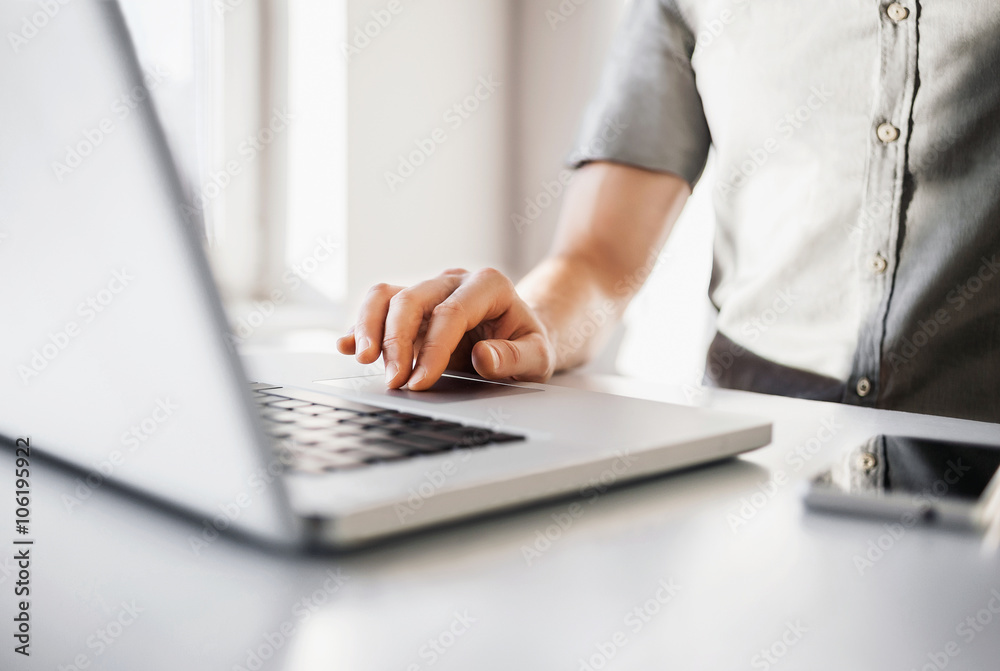 Young men using laptop