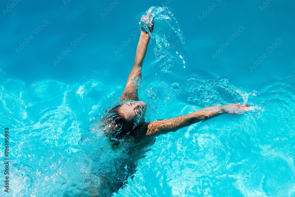 Woman heading out of pool