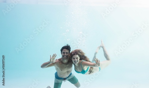 Smiling couple under water