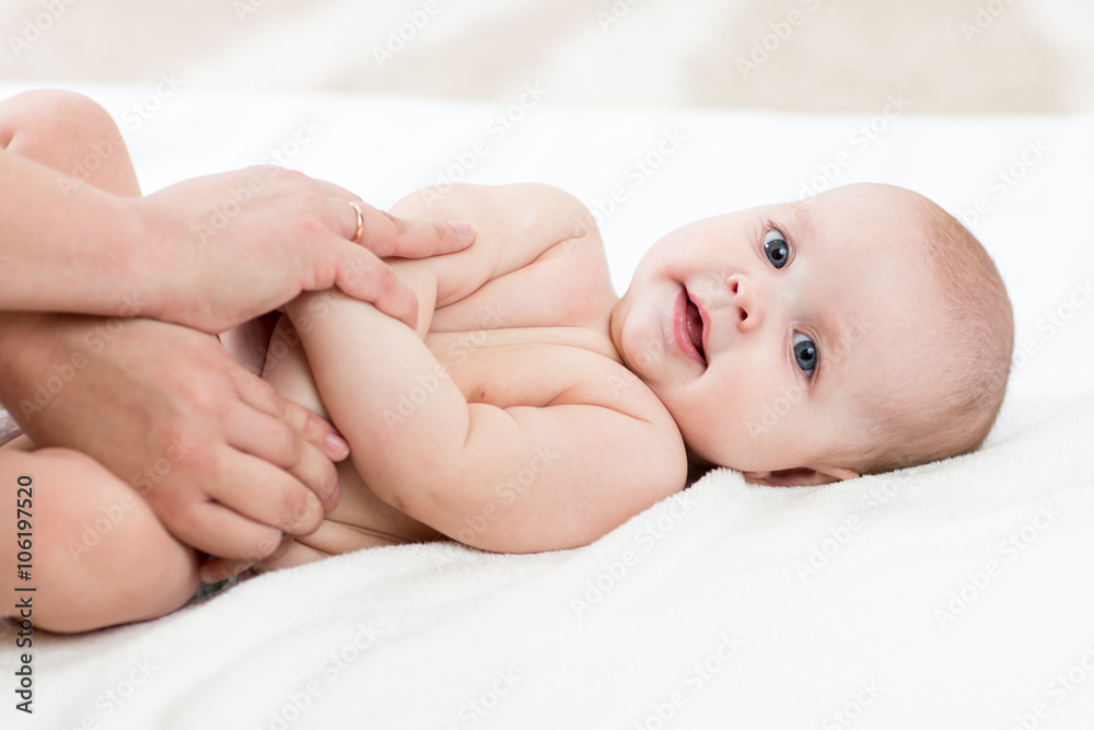 Baby massage. Mother doing gymnastics to kid. Baby massage. Mother doing gymnastics to kid.