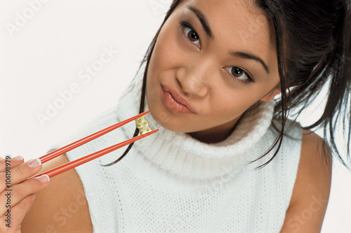 Young woman eating sweets photo