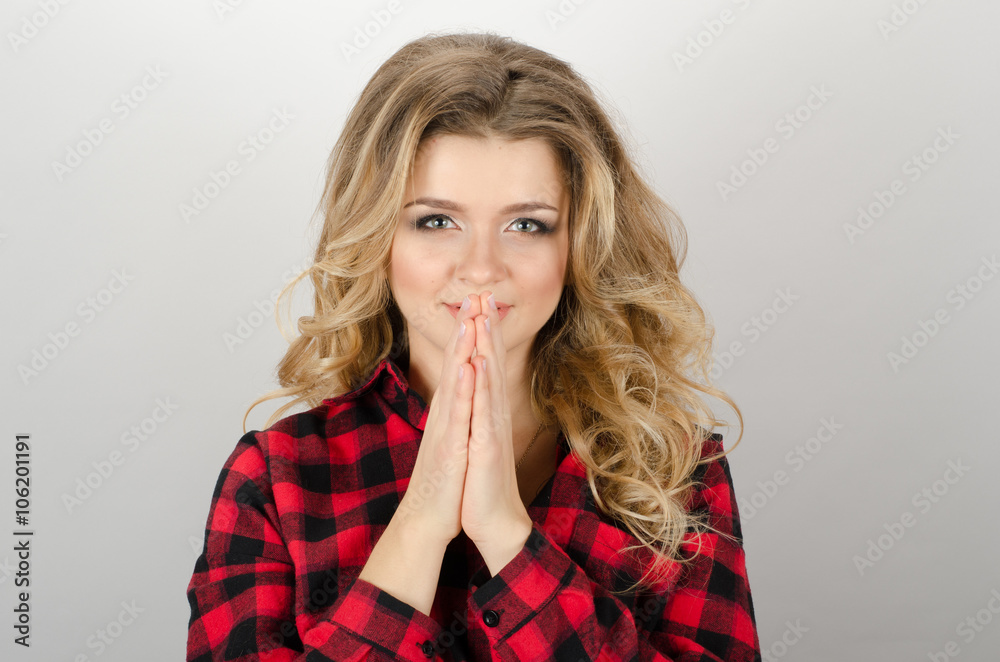 A woman asks. On a gray background. A woman asks. On a gray background.