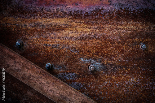 Rusty metal texture with bolts.