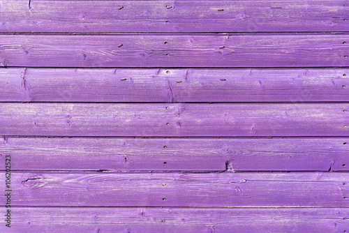 Section of purple wood panelling from a seaside beach hut. Could be used as a background to illustrate beach and summer holiday themes.
