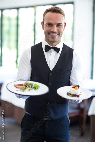 Waiter showing a dish