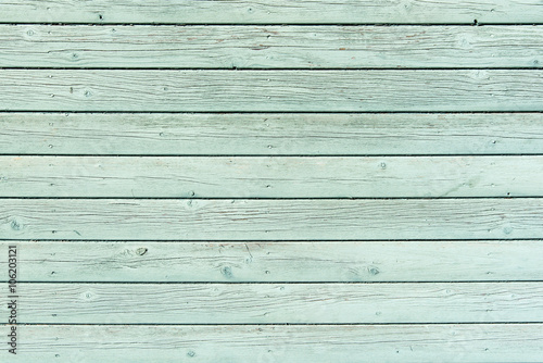 Section of pale green wood panelling from a seaside beach hut. Could be used as a background to illustrate beach and summer holiday themes. Also garden themes.

