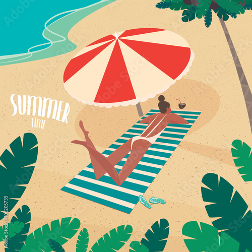 Nice girl in white swimsuit sunbathing on striped beach mat under a colorful parasol on the beach - Passive vacation or relaxation concept