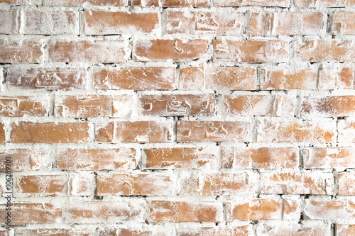 The texture of old, white and red brick wall closeup