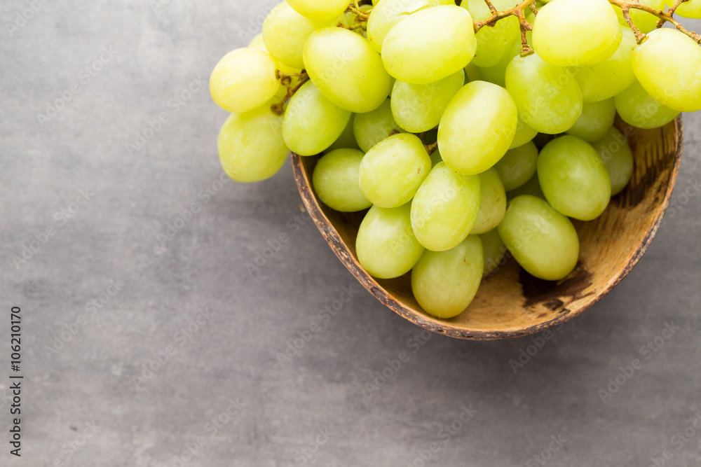 Grape cluster on the grey background. Grape cluster on the grey background.